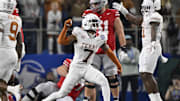 Jan 10, 2025; Arlington, Texas, USA; Texas Longhorns defensive back Jahdae Barron (7) celebrates after a sack during the second quarter of the College Football Playoff semifinal against the Ohio State Buckeyes in the Cotton Bowl at AT&T Stadium. Mandatory Credit: Jerome Miron-Imagn Images