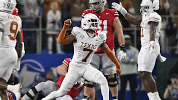 Jan 10, 2025; Arlington, Texas, USA; Texas Longhorns defensive back Jahdae Barron (7) celebrates after a sack during the second quarter of the College Football Playoff semifinal against the Ohio State Buckeyes in the Cotton Bowl at AT&T Stadium. Mandatory Credit: Jerome Miron-Imagn Images