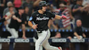 Aug 1, 2025; Miami, Florida, USA; Miami Marlins center fielder Jakob Marsee (87) scores against the New York Yankees during the ninth inning at loanDepot Park. Mandatory Credit: Sam Navarro-Imagn Images