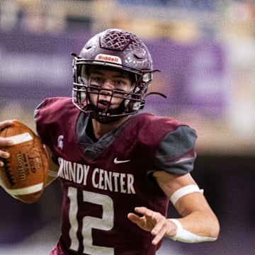 Grundy Center's Judd Jirovsky (12) keeps the ball as he runs the ball against Dike-New Hartford on Thursday, Nov. 21, 2024, at the UNI-Dome in Cedar Falls, IA.