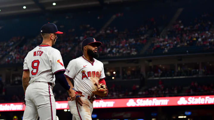 Jul 26, 2024; Anaheim, California, USA; Los Angeles Angels shortstop Zach Neto (9) greets second baseman Luis Rengifo (2) after the top of the eighth inning at Angel Stadium. Mandatory Credit: Gary A. Vasquez-USA TODAY Sports