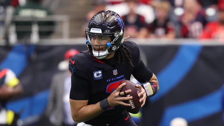 Jan 4, 2026; Houston, Texas, USA;  Houston Texans quarterback C.J. Stroud (7) looks downfield as he rolls out against the Indianapolis Colts during the first half at NRG Stadium. Mandatory Credit: Troy Taormina-Imagn Images