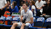 Nov 29, 2024; Durham, North Carolina, USA;  Duke Blue Devils forward Cooper Flagg (2) massages his leg prior to the second half against the Seattle Redhawks at Cameron Indoor Stadium. Mandatory Credit: Rob Kinnan-Imagn Images