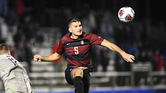 Dec 13, 2019; Cary, NC, USA; Stanford Cardinal defender Keegan Hughes (5) heads the ball in the second half at WakeMed Soccer Park. Mandatory Credit: Bob Donnan-Imagn Images