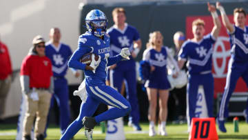 Dec 29, 2023; Jacksonville, FL, USA;  Kentucky Wildcats wide receiver Barion Brown (7) runs into the end zone for a touchdown against the Clemson Tigers in the fourth quarter during the Gator Bowl at EverBank Stadium. Mandatory Credit: Nathan Ray Seebeck-USA TODAY Sports