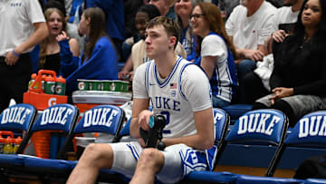 Nov 29, 2024; Durham, North Carolina, USA;  Duke Blue Devils forward Cooper Flagg (2) massages his leg prior to the second half against the Seattle Redhawks at Cameron Indoor Stadium. Mandatory Credit: Rob Kinnan-Imagn Images