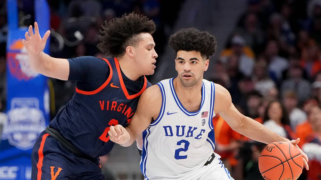 Mar 14, 2026; Charlotte, NC, USA; Duke Blue Devils guard Cayden Boozer (2) dribbles against Virginia Cavaliers guard Chance Mallory (2) during the men's ACC Conference Tournament Championship at Spectrum Center. Mandatory Credit: Bob Donnan-Imagn Images
