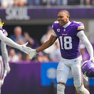 Sep 15, 2024; Minneapolis, Minnesota, USA; Minnesota Vikings wide receiver Justin Jefferson (18) celebrates an interception with cornerback Byron Murphy Jr. (7) against the San Francisco 49ers in the third quarter at U.S. Bank Stadium.