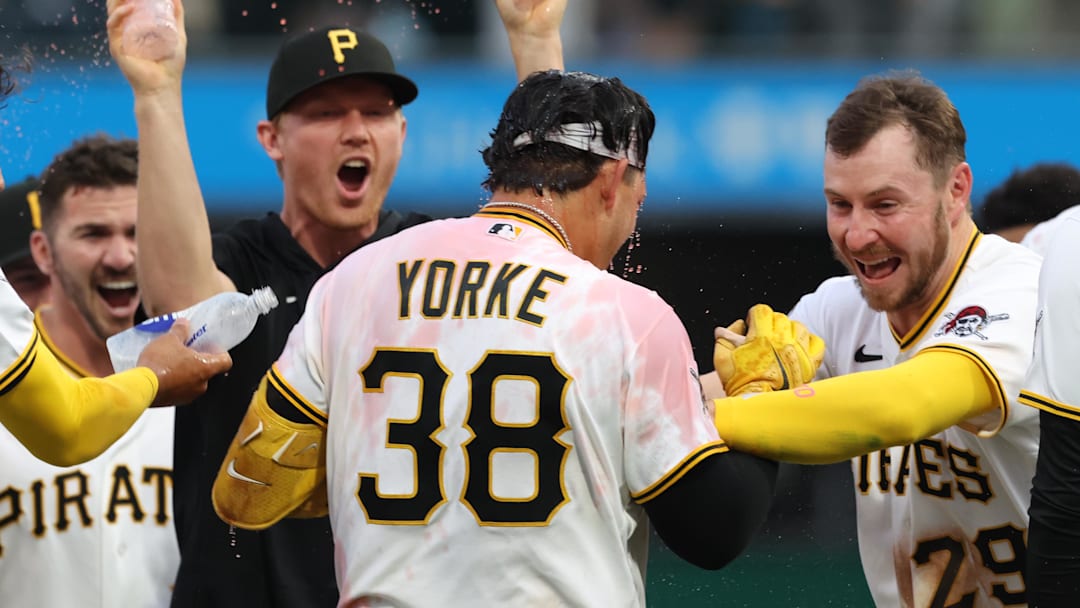Apr 4, 2026; Pittsburgh, Pennsylvania, USA;  Pittsburgh Pirates designated hitter Nick Yorke (38) and celebrates with Pittsburgh Pirates pitcher Mitch Keller (left) and right fielder Ryan O'Hearn (29) after Yorke hit  a game winning walk-off single to defeat the Baltimore Orioles in the ninth inning at PNC Park. Mandatory Credit: Charles LeClaire-Imagn Images