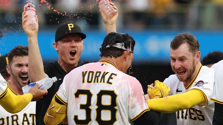 Apr 4, 2026; Pittsburgh, Pennsylvania, USA;  Pittsburgh Pirates designated hitter Nick Yorke (38) and celebrates with Pittsburgh Pirates pitcher Mitch Keller (left) and right fielder Ryan O'Hearn (29) after Yorke hit  a game winning walk-off single to defeat the Baltimore Orioles in the ninth inning at PNC Park. Mandatory Credit: Charles LeClaire-Imagn Images