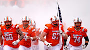 Oklahoma State runs on to the field before the college football game between the Oklahoma State Cowboys and South Dakota State Jackrabbits at Boone Pickens Stadium in Stillwater, Okla.