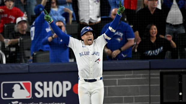 Blue Jays right fielder George Springer celebrates as he runs the bases after hitting a home run in 2025 ALCS Game 7.