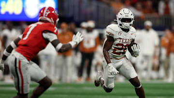 Dec 7, 2024; Atlanta, GA, USA; Texas Longhorns running back Quintrevion Wisner (26) rushes the ball against the Georgia Bulldogs during the first half in the 2024 SEC Championship game at Mercedes-Benz Stadium. Mandatory Credit: Brett Davis-Imagn Images