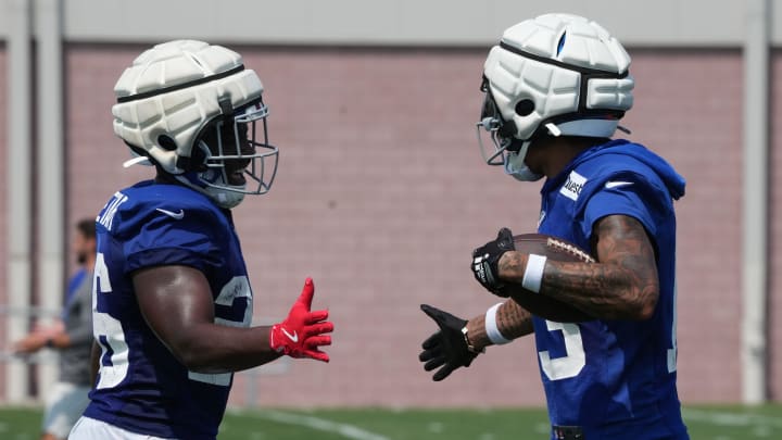 East Rutherford, NJ -- August 1, 2024 -- Running back Devin Singletary and wide receiver Jalin Hyatt after Hyatt scored a TD during practice today at training camp for the New York Giants.