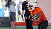 Trent Howland (24) runs drills during an Oklahoma State football practice in Stillwater, Okla., on Wednesday, July 31, 2024.