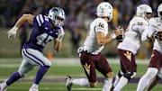 Nov 16, 2024; Manhattan, Kansas, USA; Kansas State Wildcats linebacker Austin Romaine (45) chases Arizona State Sun Devils quarterback Sam Leavitt (10) during the third quarter at Bill Snyder Family Football Stadium. Mandatory Credit: Scott Sewell-Imagn Images