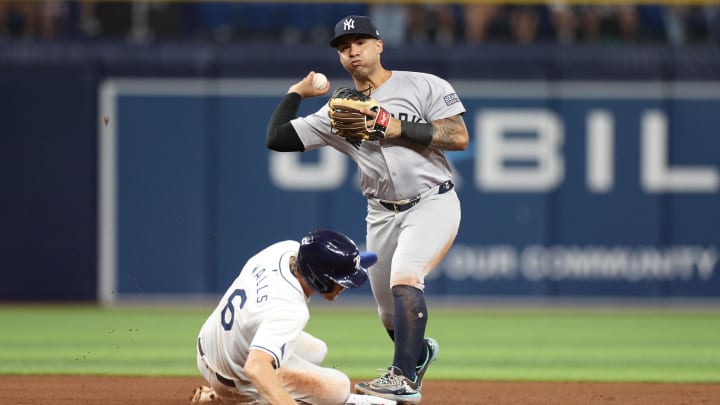 Jul 10, 2024; St. Petersburg, Florida, USA; New York Yankees second baseman Gleyber Torres (25) attempts a double play against the Tampa Bay Rays in the fifth inning at Tropicana Field. 