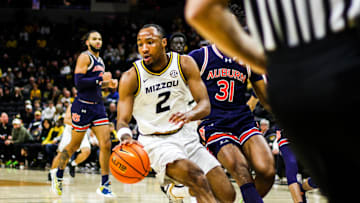 Mizzou men's basketball guard Tamar Bates dribbles during a game against Auburn on Tuesday at Mizzou Arena in Columbia