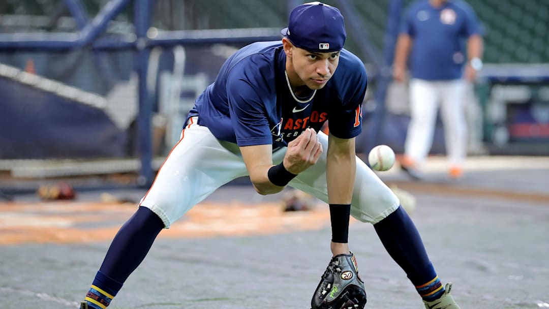 Houston Astros center fielder Mauricio Dubon (14) warms up prior to the game against the Seattle Mariners at Daikin Park. 