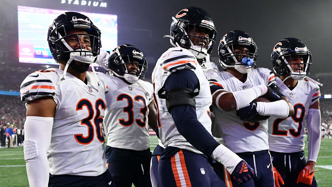 Oct 24, 2022; Foxborough, Massachusetts, USA; Chicago Bears safety DeAndre Houston-Carson (36), cornerback Jaylon Johnson (33), defensive end Dominique Robinson (91), safety Jaquan Brisker (9), and cornerback Dane Cruikshank (29) celebrate after an interception against the New England Patriots during the first half at Gillette Stadium. Mandatory Credit: Brian Fluharty-Imagn Images