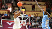 Mar 4, 2025; Blacksburg, Virginia, USA;  Virginia Tech Hokies guard Jaydon Young (3) shoots a shot as North Carolina Tar Heels guard Ian Jackson (11) defends during the first half at Cassell Coliseum. Mandatory Credit: Brian Bishop-Imagn Images