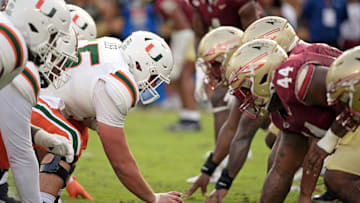 Nov 11, 2023; Tallahassee, Florida, USA; Miami Hurricanes center Matt Lee (55) about to snap the ball during the game against the Florida State Seminoles at Doak S. Campbell Stadium. Mandatory Credit: Melina Myers-Imagn Images