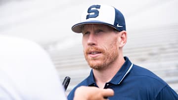 Penn State football offensive line coach Phil Trautwein talks to a reporter during football media day at Beaver Stadium on Sunday, August 6, 2023, in State College.