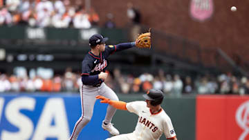 Jun 8, 2025; San Francisco, California, USA; San Francisco Giants third baseman Matt Chapman (26) slips safely into second base with a double ahead of the relay to Atlanta Braves shortstop Nick Allen (2) during the second inning at Oracle Park. Mandatory Credit: D. Ross Cameron-Imagn Images