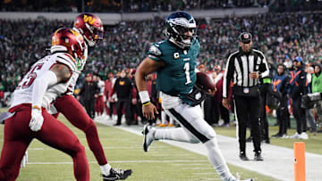 Jan 26, 2025; Philadelphia, PA, USA; Philadelphia Eagles quarterback Jalen Hurts (1) runs with the ball for a touchdown against the Washington Commanders during the second half in the NFC Championship game at Lincoln Financial Field. Mandatory Credit: Eric Hartline-Imagn Images