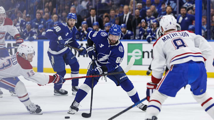 May 3, 2026; Tampa, Florida, USA; Tampa Bay Lightning forward Nikita Kucherov (86) skates between Montreal Canadiens forward Cole Caufield (13) and defenseman Mike Matheson (8) during the first period in game seven of the first round of the 2026 Stanley Cup Playoffs at Benchmark International Arena. Mandatory Credit: Morgan Tencza-Imagn Images