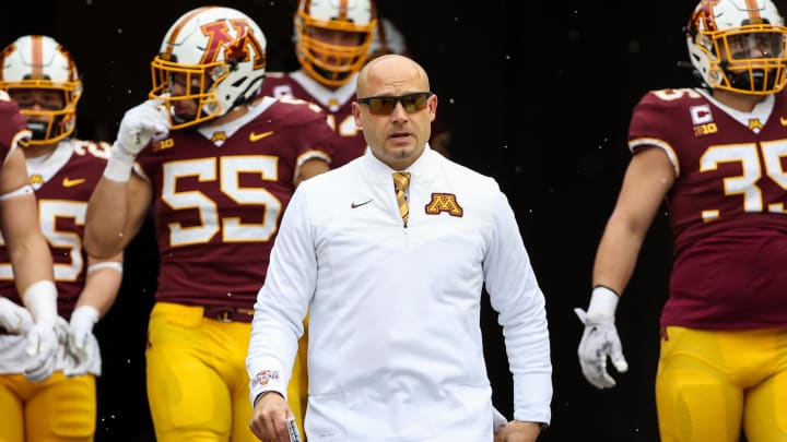 Nov 12, 2022; Minneapolis, Minnesota, USA; Minnesota Golden Gophers head coach P.J. Fleck leads his team out onto the field before the game against the Northwestern Wildcats at Huntington Bank Stadium.