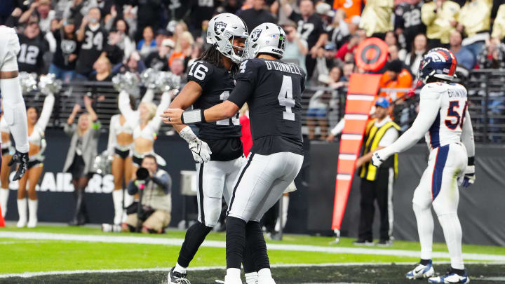 Jan 7, 2024; Paradise, Nevada, USA; Las Vegas Raiders wide receiver Jakobi Meyers (16) celebrates with Las Vegas Raiders quarterback Aidan O'Connell (4) after scoring a touchdown against the Denver Broncos during the first quarter at Allegiant Stadium. Mandatory Credit: Stephen R. Sylvanie-USA TODAY Sports