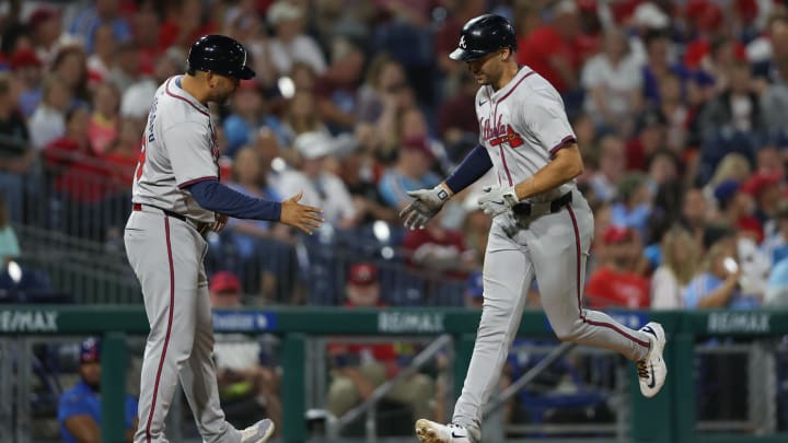 Aug 29, 2024; Philadelphia, Pennsylvania, USA; Atlanta Braves first base Matt Olson (28) is congratulated by third base coach Matt Tuiasosopo (89) as he runs the base after hitting his second home run of the game against the Philadelphia Phillies during the sixth inning at Citizens Bank Park. Mandatory Credit: Bill Streicher-USA TODAY Sports