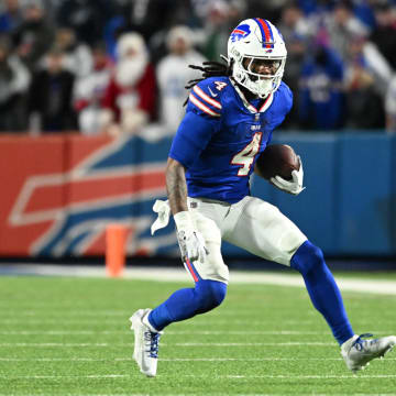 Dec 17, 2023; Orchard Park, New York, USA; Buffalo Bills running back James Cook (4) runs the ball in the second half against the Dallas Cowboys at Highmark Stadium. Mandatory Credit: Mark Konezny-USA TODAY Sports
