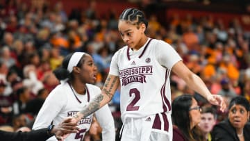 Mississippi State guard Jerkaila Jordan (2) high-fives teammates as she comes off the court during the third quarter of the SEC Women's Basketball Tournament game three at the Bon Secours Wellness Arena in Greenville, S.C. Thursday, March 7, 2024.