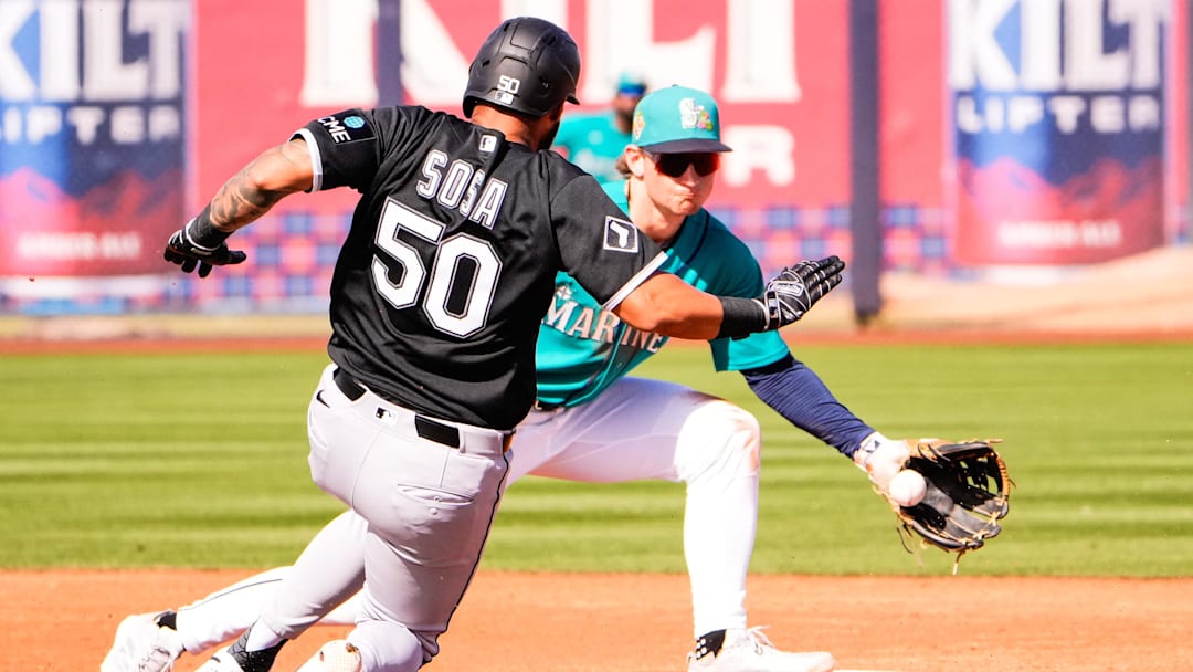 Feb 24, 2026; Peoria, Arizona, USA;  Seattle Mariners shortstop Colt Emerson (85) prepares to tag out Chicago White Sox second baseman Lenyn Sosa (50) at second base during the third inning in Peoria, Arizona. Mandatory Credit: Arianna Grainey-Imagn Images