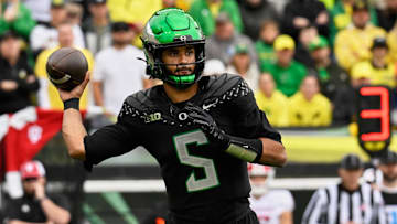 Oct 11, 2025; Eugene, Oregon, USA; Oregon Ducks quarterback Dante Moore (5) throws a pass against the Indiana Hoosiers during the first quarter at Autzen Stadium. Mandatory Credit: Troy Wayrynen-Imagn Images