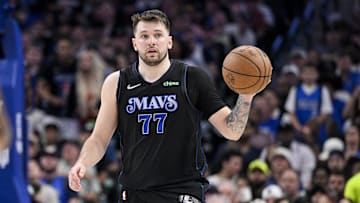 Dallas Mavericks guard Luka Doncic (77) brings the ball up court.