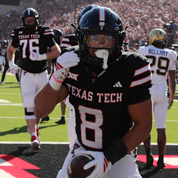 Texas Tech Red Raiders running back Cameron Dickey (8) reacts after scoring a touchdown against the Central Florida Knights in the first half at Jones AT&T Stadium.