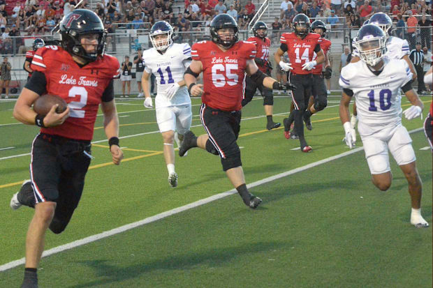 Lake Travis quarterback Chaston Ditta coasts into the end zone for a 36-yard touchdown in the first quarter vs. San Marcos.