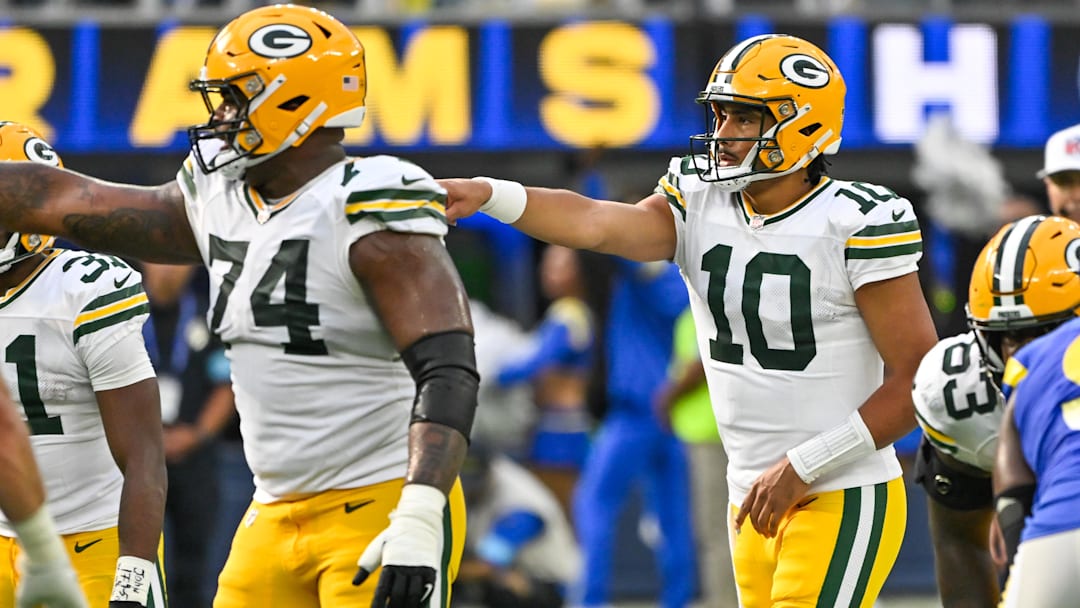 Oct 6, 2024; Inglewood, California, USA; Green Bay Packers guard Elgton Jenkins (74) and Green Bay Packers quarterback Jordan Love (10) during the third quarter against the Los Angeles Rams at SoFi Stadium. Mandatory Credit: Robert Hanashiro-Imagn Images
