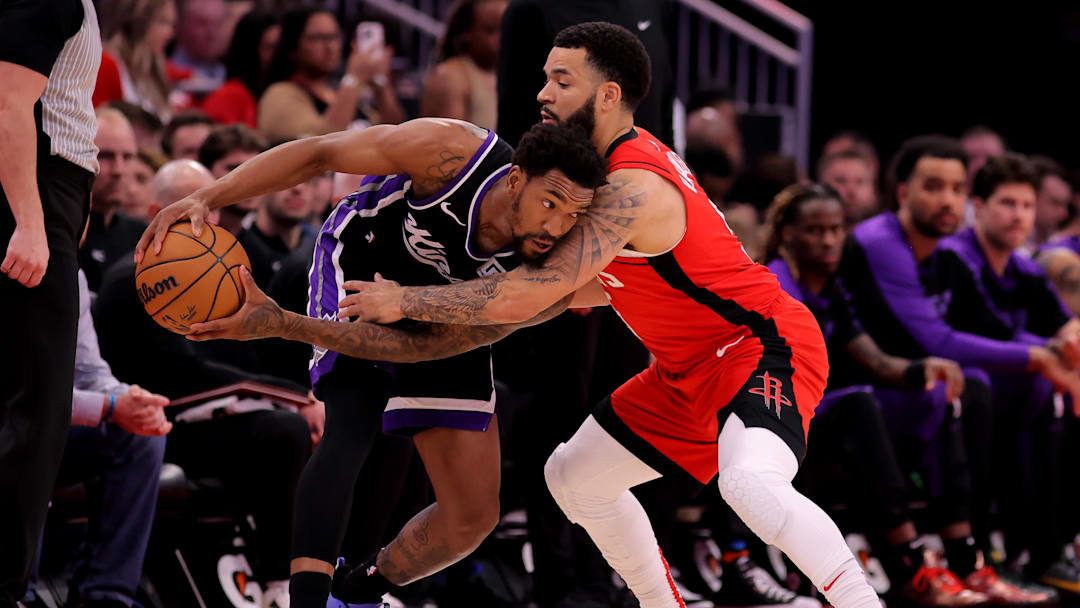 Mar 1, 2025; Houston, Texas, USA; Sacramento Kings guard Malik Monk (0) handles the ball against Houston Rockets guard Fred VanVleet (5) during the first quarter at Toyota Center. Mandatory Credit: Erik Williams-Imagn Images
