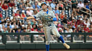 Jun 17, 2025; Omaha, Neb, USA;  UCLA Bruins shortstop Roch Cholowsky (1) throws to first base against the Arkansas Razorbacks during the third inning at Charles Schwab Field. Mandatory Credit: Steven Branscombe-Imagn Images