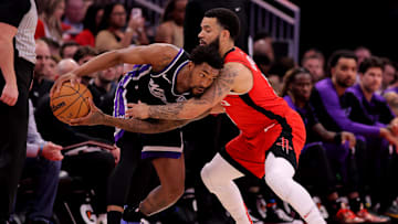Mar 1, 2025; Houston, Texas, USA; Sacramento Kings guard Malik Monk (0) handles the ball against Houston Rockets guard Fred VanVleet (5) during the first quarter at Toyota Center. Mandatory Credit: Erik Williams-Imagn Images