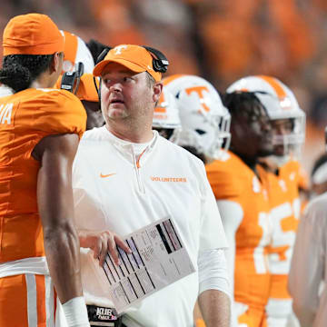 Tennessee head coach Josh Heupel and Tennessee quarterback Nico Iamaleava (8) chat on the sidelines during a game between Tennessee and Kent State at Neyland Stadium, in Knoxville, Tenn., Saturday, Sept. 14, 2024.