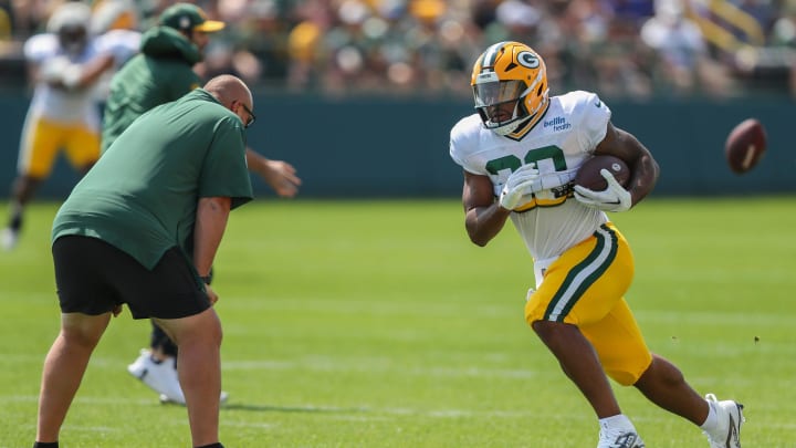 Green Bay Packers running back AJ Dillon (28) runs through a drill on Saturday, July 27, 2024, at Ray Nitschke Field in Ashwaubenon, Wis.
Tork Mason/USA TODAY NETWORK-Wisconsin