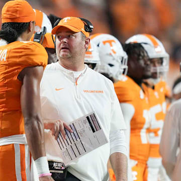 Tennessee head coach Josh Heupel and Tennessee quarterback Nico Iamaleava (8) chat on the sidelines during a game between Tennessee and Kent State at Neyland Stadium, in Knoxville, Tenn., Saturday, Sept. 14, 2024.