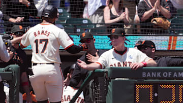 Jun 2, 2024; San Francisco, California, USA; San Francisco Giants left fielder Heliot Ramos (17) is congratulated by manager Bob Melvin (right) after hitting a home run against the New York Yankees during the third inning at Oracle Park.