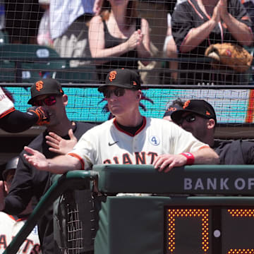 Jun 2, 2024; San Francisco, California, USA; San Francisco Giants left fielder Heliot Ramos (17) is congratulated by manager Bob Melvin (right) after hitting a home run against the New York Yankees during the third inning at Oracle Park.