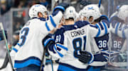 Mar 16, 2025; Seattle, Washington, USA;  Winnipeg Jets forward Kyle Connor (81) celebrates after scoring a goal with forward Gabriel Vilardi (13) and forward Morgan Barron (36) during the second period against the Seattle Kraken at Climate Pledge Arena. Mandatory Credit: Stephen Brashear-Imagn Images